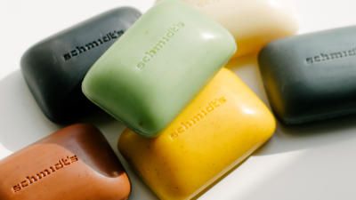 A variety of schmidt's bar soap laid on a white background